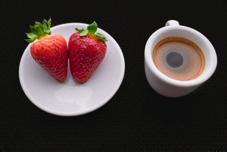 A Cup of coffee with some strawberry on different backgroundの写真素材