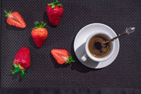 A Cup of coffee with some strawberry on different backgroundの写真素材