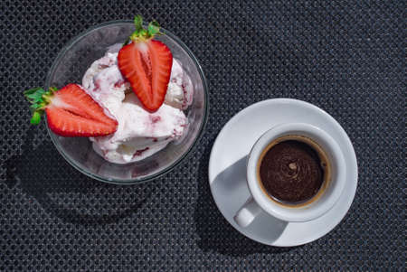 A Cup of coffee with some strawberry on different backgroundの写真素材