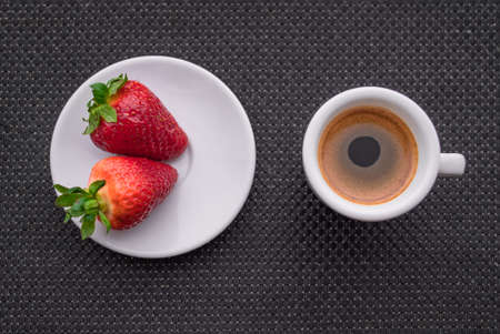 A Cup of coffee with some strawberry on different backgroundの写真素材