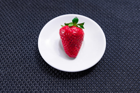 A Cup of coffee with some strawberry on different backgroundの写真素材