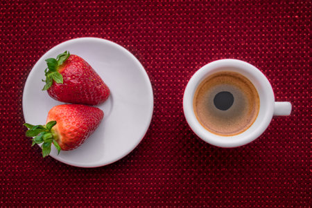 A Cup of coffee with some strawberry on different backgroundの写真素材