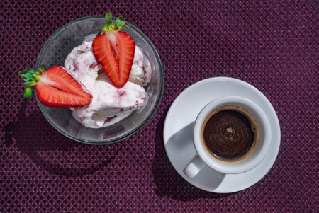 A Cup of coffee with some strawberry on different backgroundの写真素材