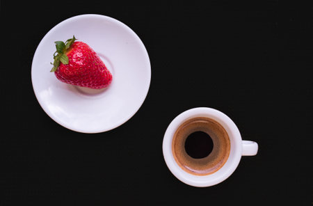 A Cup of coffee with some strawberry on different backgroundの写真素材
