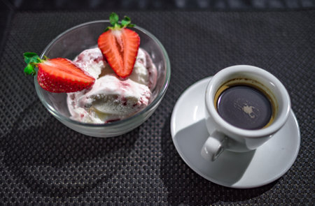 A Cup of coffee with some strawberry on different backgroundの写真素材