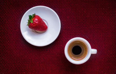 A Cup of coffee with some strawberry on different backgroundの写真素材