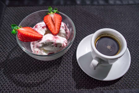 A Cup of coffee with some strawberry on different backgroundの写真素材