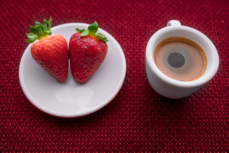A Cup of coffee with some strawberry on different backgroundの写真素材