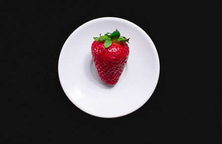 A Cup of coffee with some strawberry on different backgroundの写真素材
