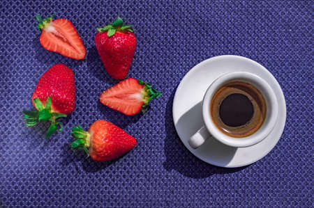 A Cup of coffee with some strawberry on different backgroundの写真素材