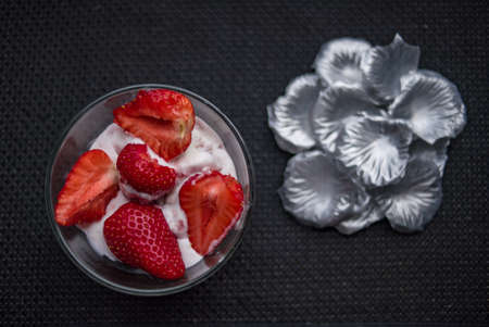 A Cup of coffee with some strawberry on different backgroundの写真素材