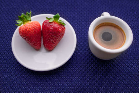 A Cup of coffee with some strawberry on different backgroundの写真素材
