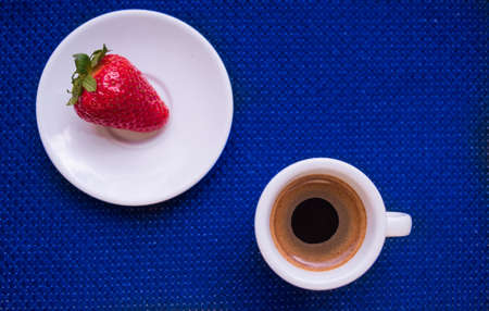A Cup of coffee with some strawberry on different backgroundの写真素材