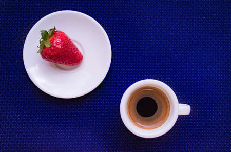A Cup of coffee with some strawberry on different backgroundの写真素材