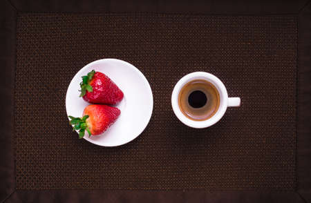 A Cup of coffee with some strawberry on different backgroundの写真素材