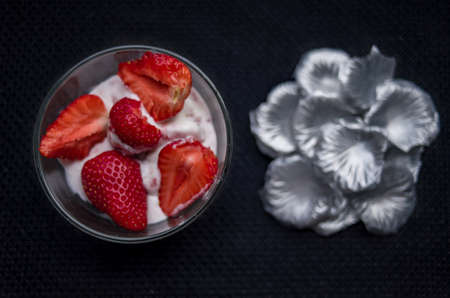 A Cup of coffee with some strawberry on different backgroundの写真素材