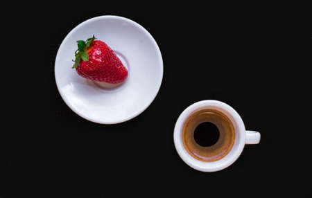 A Cup of coffee with some strawberry on different backgroundの写真素材