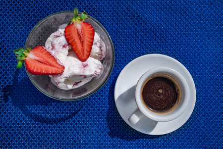 A Cup of coffee with some strawberry on different backgroundの写真素材
