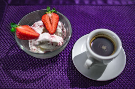 A Cup of coffee with some strawberry on different backgroundの写真素材