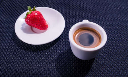 A Cup of coffee with some strawberry on different backgroundの写真素材