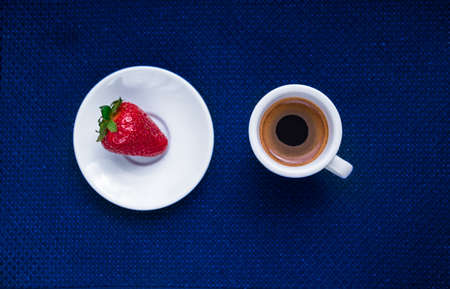 A Cup of coffee with some strawberry on different backgroundの写真素材