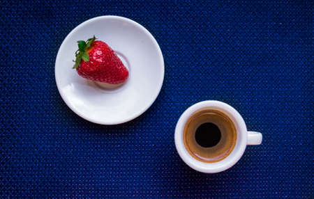 A Cup of coffee with some strawberry on different backgroundの写真素材