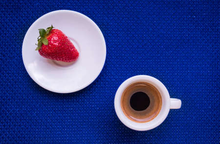 A Cup of coffee with some strawberry on different backgroundの写真素材