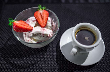 A Cup of coffee with some strawberry on different backgroundの写真素材