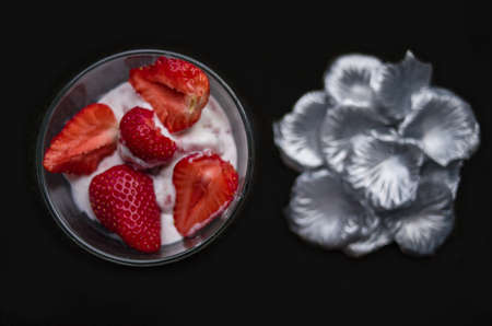 A Cup of coffee with some strawberry on different backgroundの写真素材