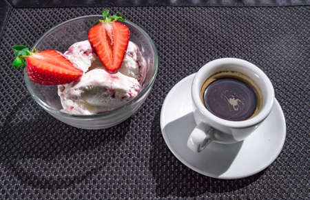 A Cup of coffee with some strawberry on different backgroundの写真素材