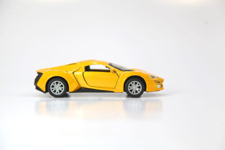 toy car on the road on a white bacground .