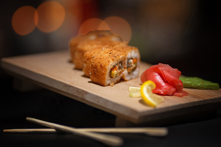 Japanese food. Appetizing sushi on a wooden board.の写真素材