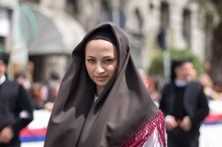 Cagliari, Sardinia, Italy - May 1, 2014: Girl with the Sardinian typical costumes during the festival of Saint Efisio. Cagliari, Sardinia, Italy.のeditorial素材