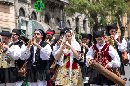 Cagliari, Sardinia, Italy - May 1, 2014: launeddas players with the Sardinian typical costumes during the festival of Saint Efisio. Cagliari, Sardinia, Italy.のeditorial素材