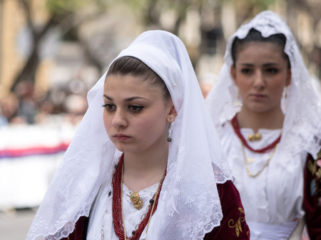 Cagliari, Sardinia, Italy - May 1, 2014: Girl with the Sardinian typical costumes during the festival of Saint Efisio. Cagliari, Sardinia, Italy.のeditorial素材