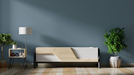 Cabinet TV in empty interior room ,dark wall with wood shelf,lamp ,plants and table wood ,3d renderingの写真素材