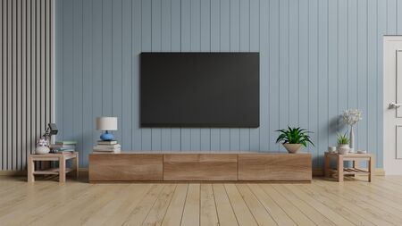 TV in modern empty room blue wall. 3d renderingの写真素材