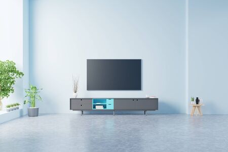 TV on the cabinet in modern living room on blue wall background,3d renderingの写真素材