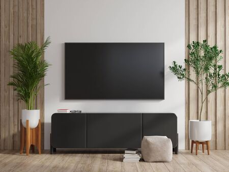 TV on wall and cabinet in modern living room on white wall background,3d renderingの写真素材
