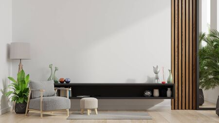 Cabinets and wall for tv in living room with armchair, Mockup white wall,3D renderingの写真素材