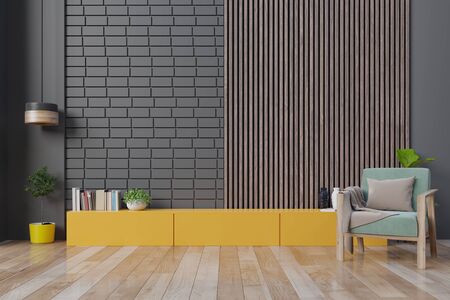 Modern living room interior armchair ,TV on cabinet in modern living room with lamp,table,flower and plant on wooden wall background,3d renderingの写真素材