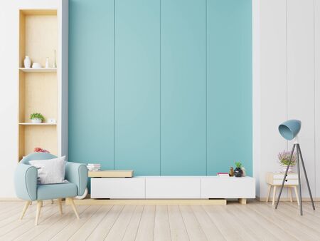 Cabinet TV in modern living room with armchair on blue wall background,3d renderingの写真素材