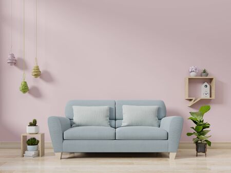Modern living room interior with sofa and green plants,lamp,table on pink wall background. 3d renderingの写真素材