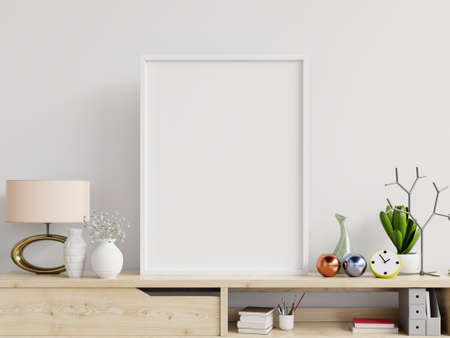 Poster mockup with vertical frame on table and white wall background,3D renderingの写真素材