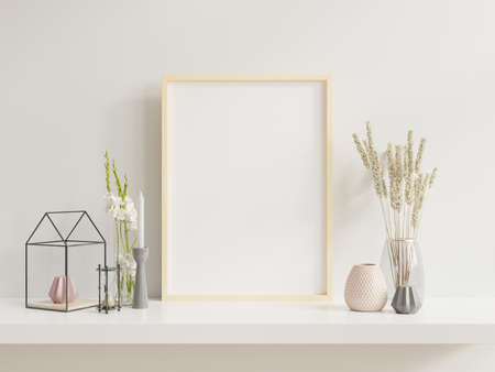 Wooden frame leaning on white shelf in bright interior with plants on the table with plants in pots on empty wall background.3D renderingの写真素材