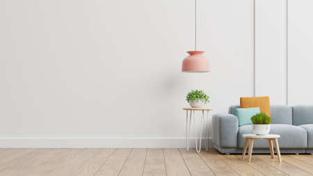 Empty living room with blue sofa, plants and table on empty white wall background. 3D renderingの写真素材