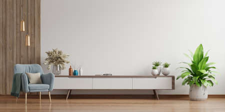 Cabinet TV in modern living room,Interior of a bright living room with armchair on empty white wall background.3D renderingの写真素材