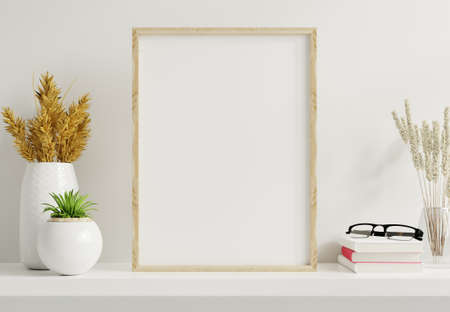 Home interior poster mock up with vertical gold frame with ornamental plants in pots on empty wall background.3D renderingの写真素材