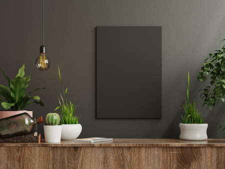 Mockup frame on cabinet in living room interior on empty dark wall background,3D renderingの写真素材