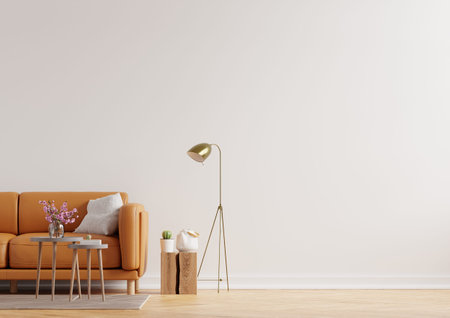Living room interior wall mockup in warm tones with leather sofa on white wall background.3d...